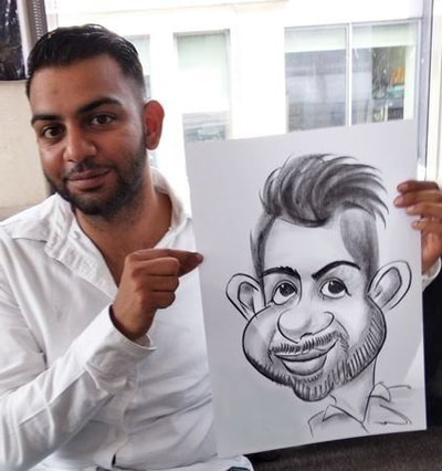 Caricature artist draws cheeks