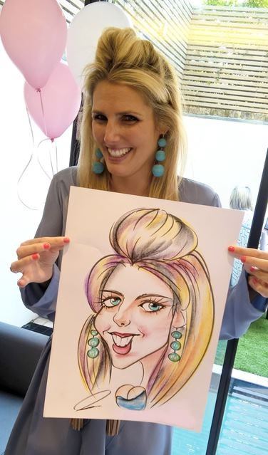 Caricaturist drawing in colour