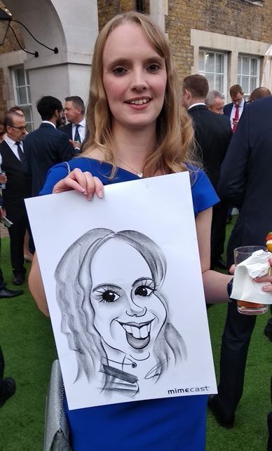 Caricaturist drawing at party