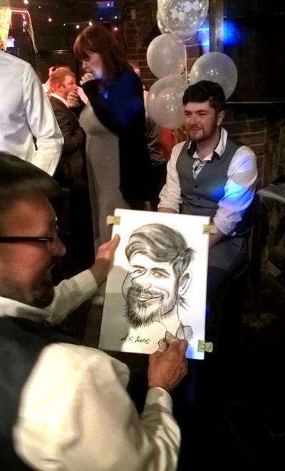 Alex drawing at wedding event